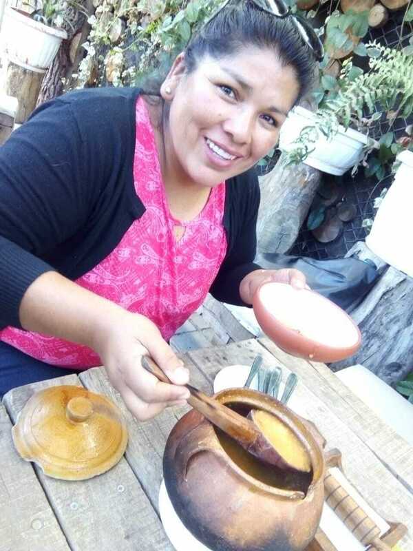 Delia tasting Quechua food