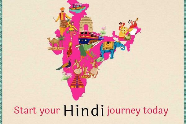 Pink map of India filled with illustrations of its culture: India Gate, train, dancers, elephant, peacock, camel, musicians.